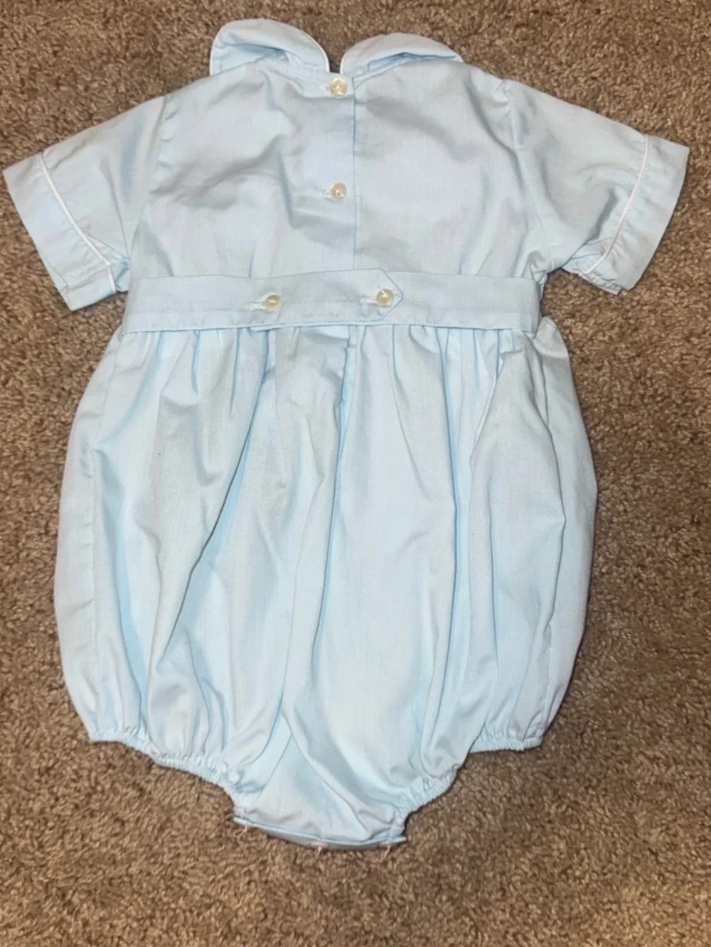 Baby blue smocked romper with embroidered floral design size 24m